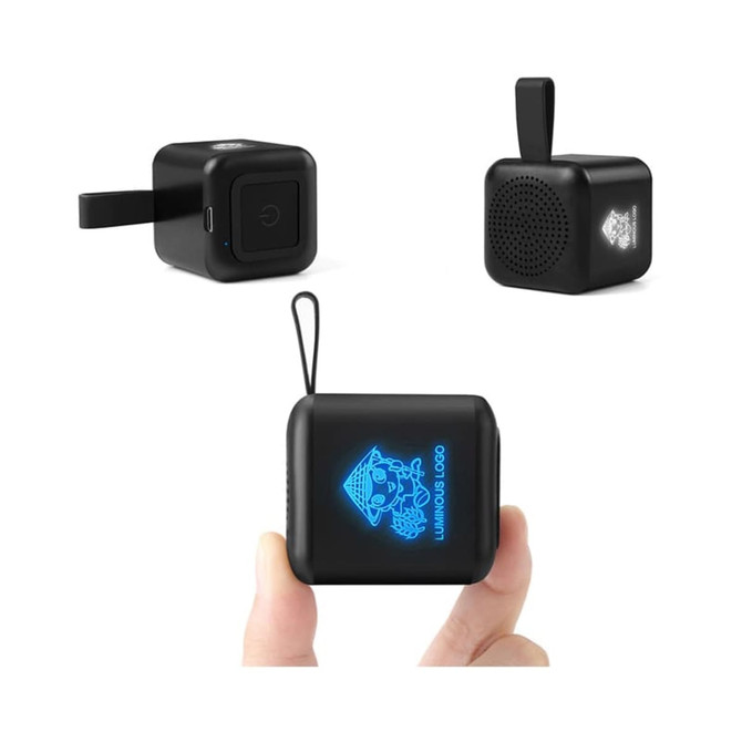 A black Mini Cube Light Up Bluetooth speaker featuring a logo, designed in a compact, portable shape.