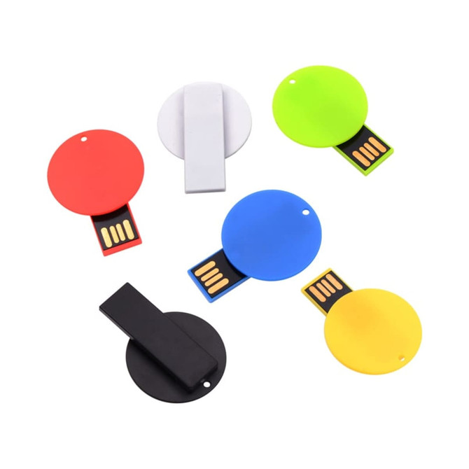 A collection of six round flash drives in red, white, green, blue, black, and yellow, each with a USB connector.