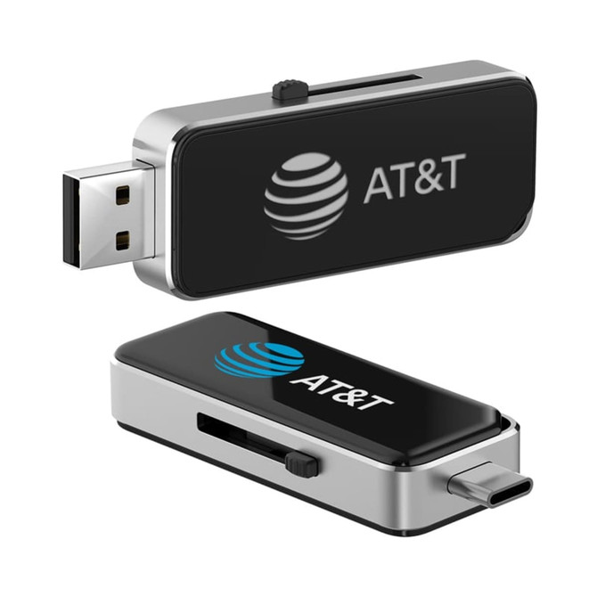 A metallic flash drive with a black casing, featuring a logo. It has both USB and Type-C connectors.