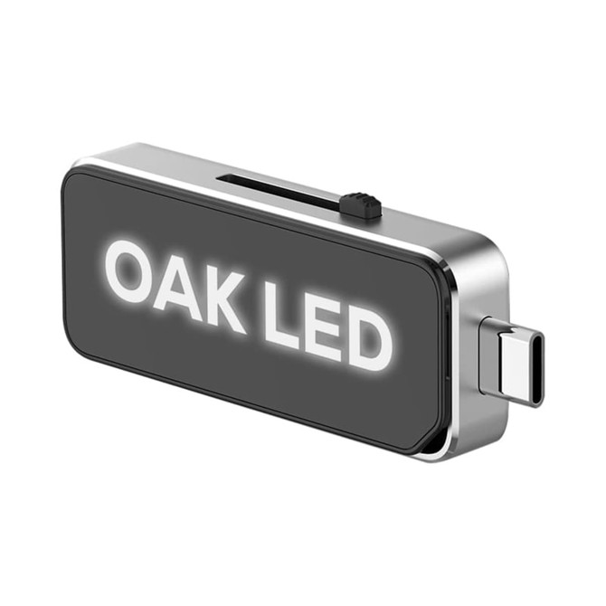 A sleek silver and black USB flash drive with a Type-C connector and a visible logo.
