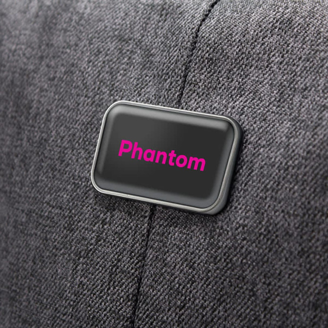 A grey backpack with a logo on the side, featuring the word "Phantom" in pink.