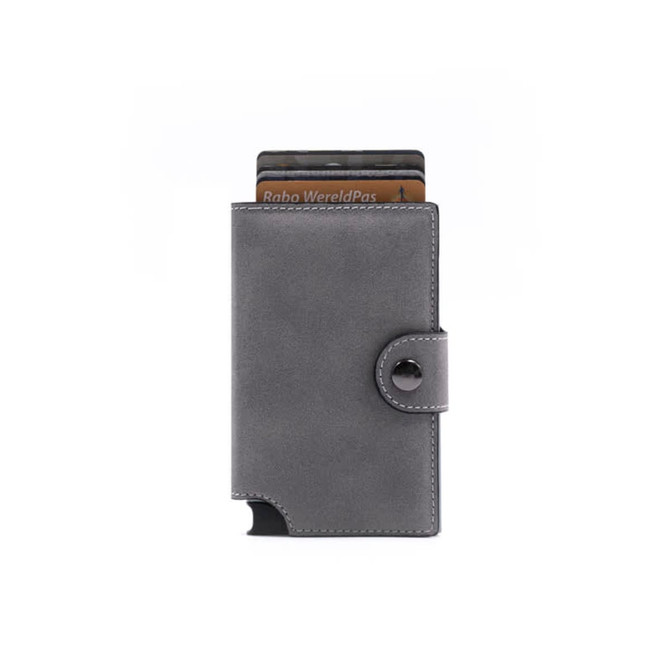 A grey vegan leather wallet with a button closure and several cards partially visible. It features a branding logo.