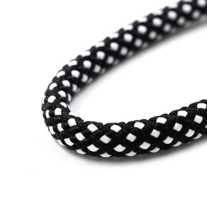 A black and white braided strap with a textured finish, designed for crossbody use with phones.