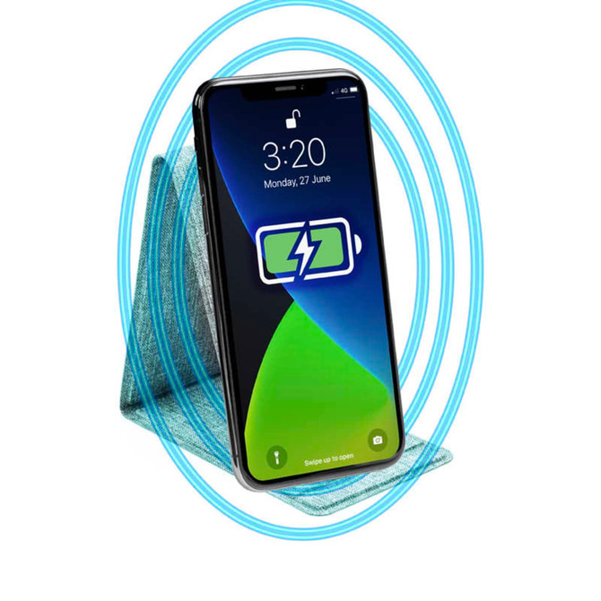 A wireless phone charger in teal, designed for charging devices, with a smartphone positioned on top.