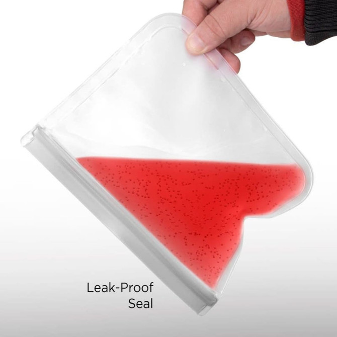 A person holding a transparent, red PEVA reusable food storage bag with a leak-proof seal.