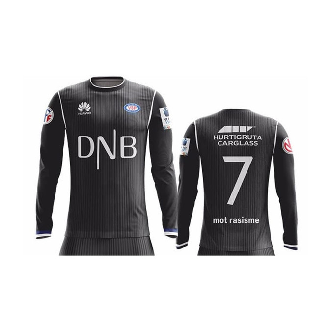 A long sleeve soccer jersey in black featuring a vertical striped pattern and a logo on the sleeve.