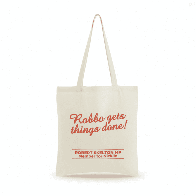A Calico Tote Bag in cream with red text and a logo. Features sturdy handles for easy carrying.