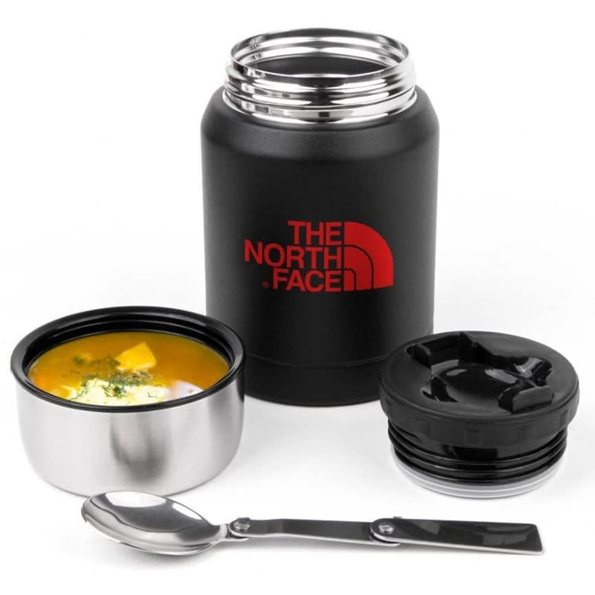 A drink bottle in matte black with a red logo, accompanied by a stainless steel bowl, lid, and spoon.