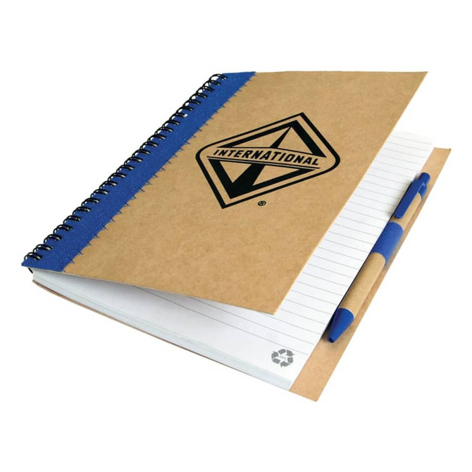 A recycled paper notebook with a brown cover, blue spiral binding, and a pen, featuring a logo on the front.