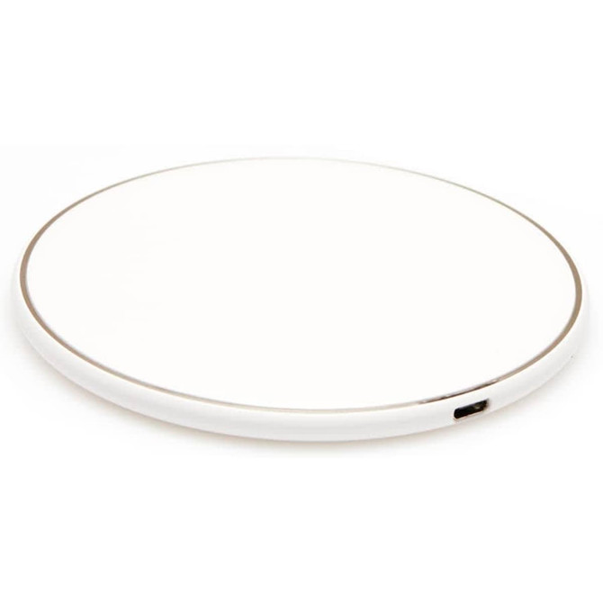 A round wireless charging dock in white with a subtle silver edge. Includes a USB port for charging.