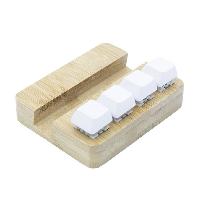 A bamboo stand holder featuring four white key pressing stress relievers. It has a smooth, natural finish.