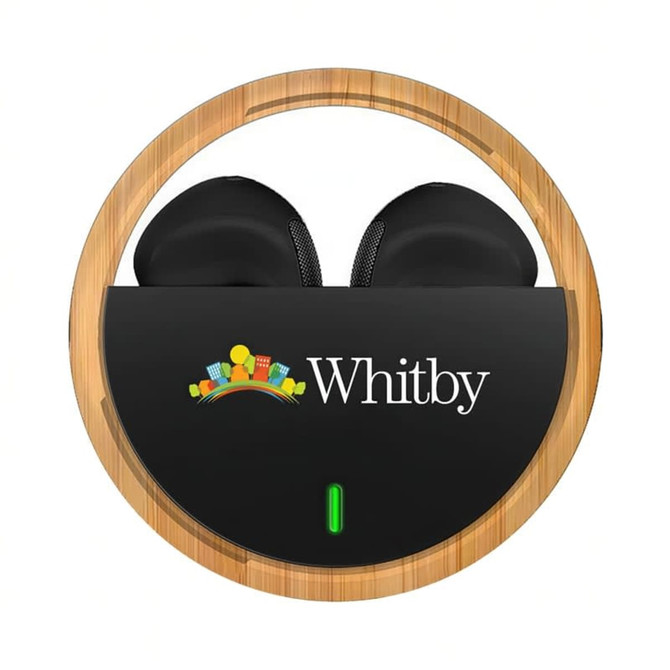 Black TWS earbuds in a circular wooden case featuring a logo, with a green light indicator.