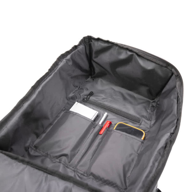 A black backpack interior featuring multiple pockets, including a zippered section and space for pens and small items.