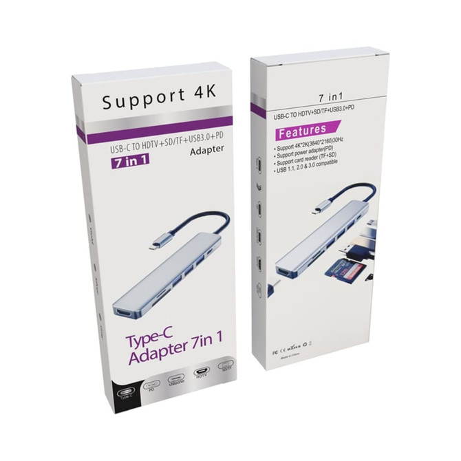 A Type-C adapter in a box, featuring multiple ports including HDMI and USB, displayed in a white package with branding.
