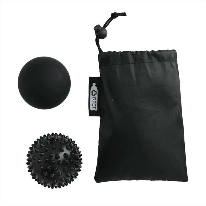 A set of two black massage balls beside a small black pouch. One ball is smooth, the other has spiky texture.