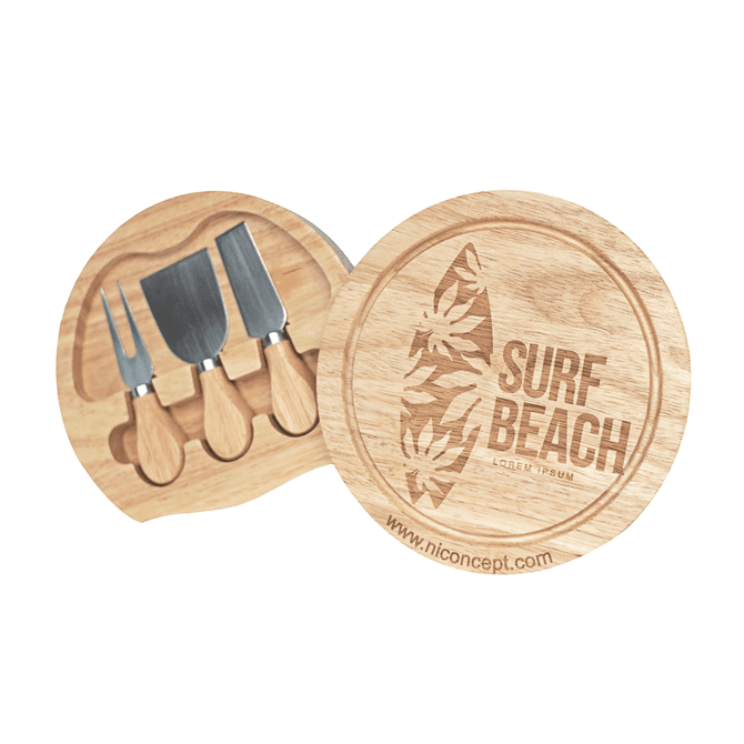 A wooden cheese board with three knives, featuring a Surf Beach logo and a natural finish.