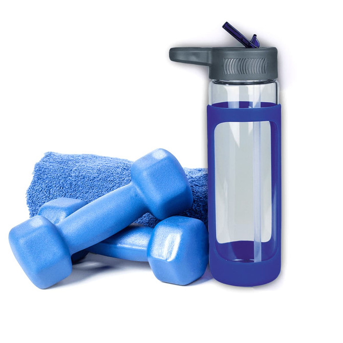 A drink bottle with a grey lid and blue silicone cover, alongside blue dumbbells and a blue towel.