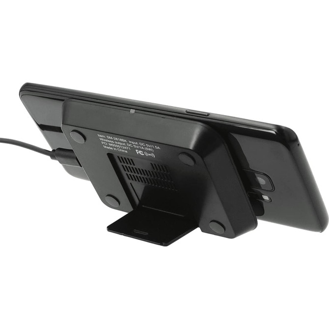 A black wireless charging phone stand with a phone resting against it, featuring a logo on the base.
