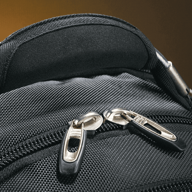A black computer backpack featuring dual zippers and a padded top handle for easy carrying.