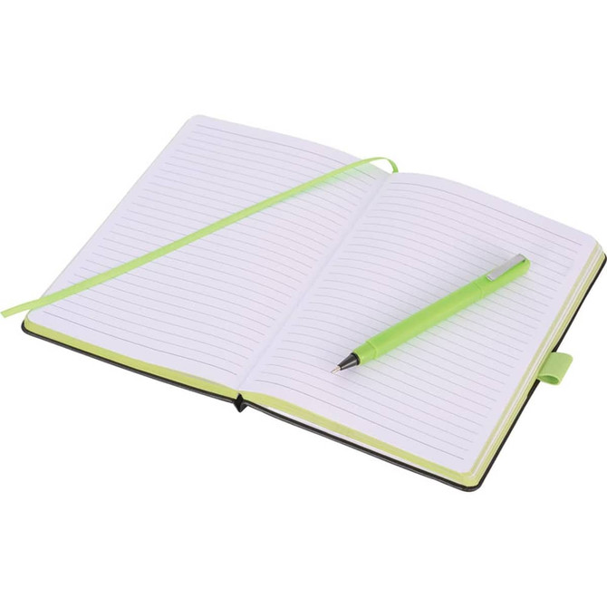 A bound journal in black with green accents, featuring lined pages and a matching green pen.