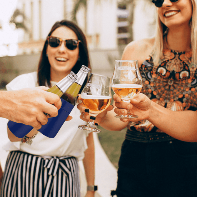A drink bottle holder in navy blue, surrounded by glasses of beer and cheers among friends in an outdoor setting.