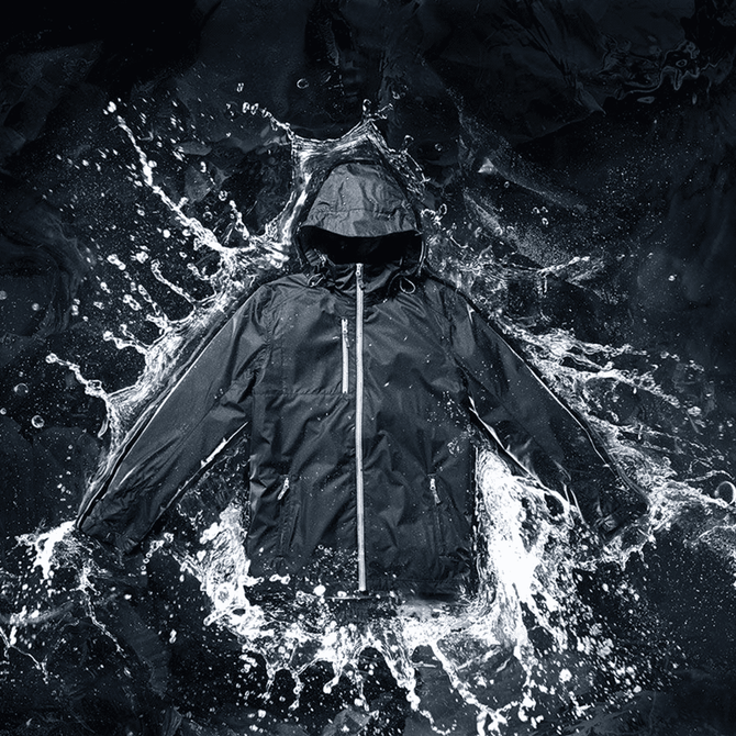A men's rain jacket in black with a hood, featured against a splash of water. Includes a logo.