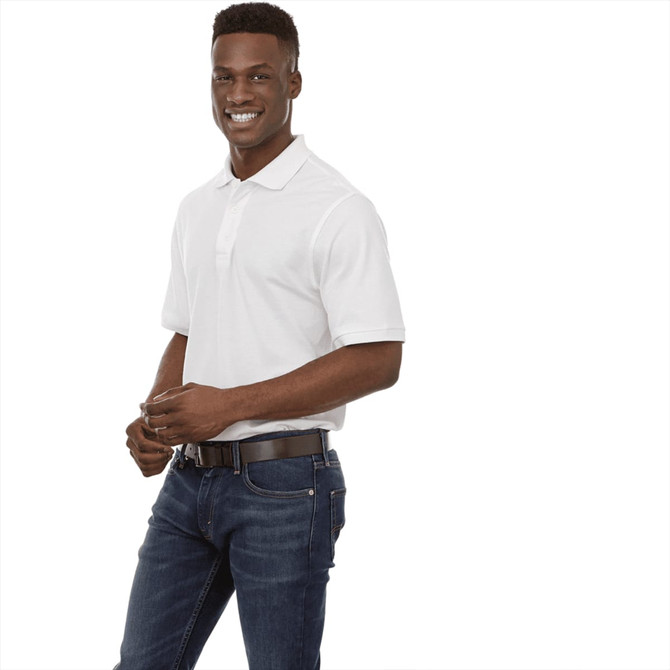 A man wearing a short sleeve white polo shirt paired with jeans, featuring a visible belt.