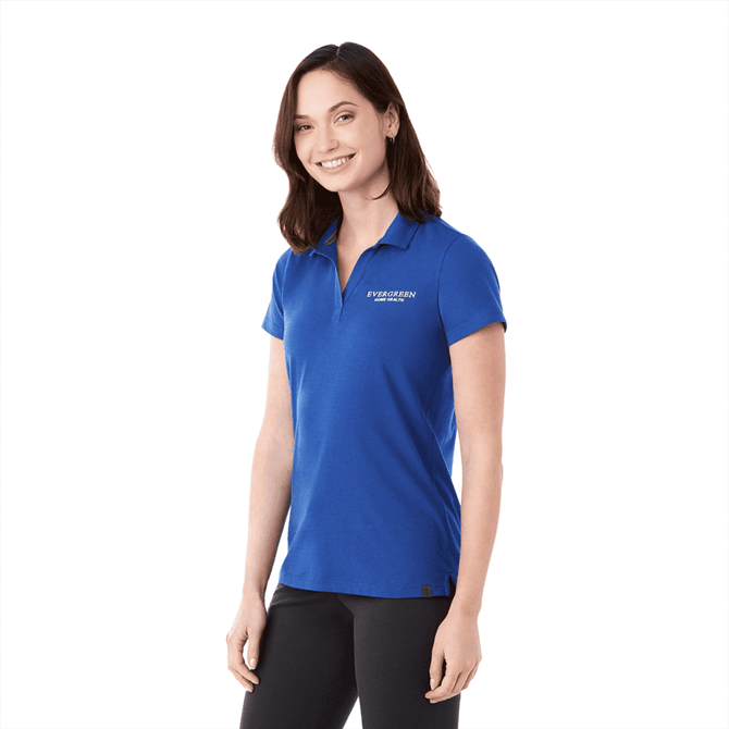 A short sleeve women's polo shirt in blue with a logo on the chest.