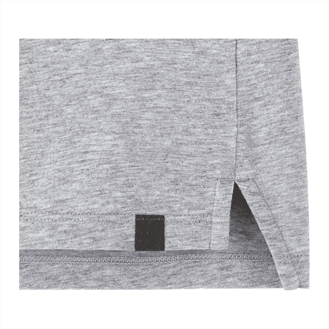A grey women's polo shirt featuring a side split and a logo on the hem.