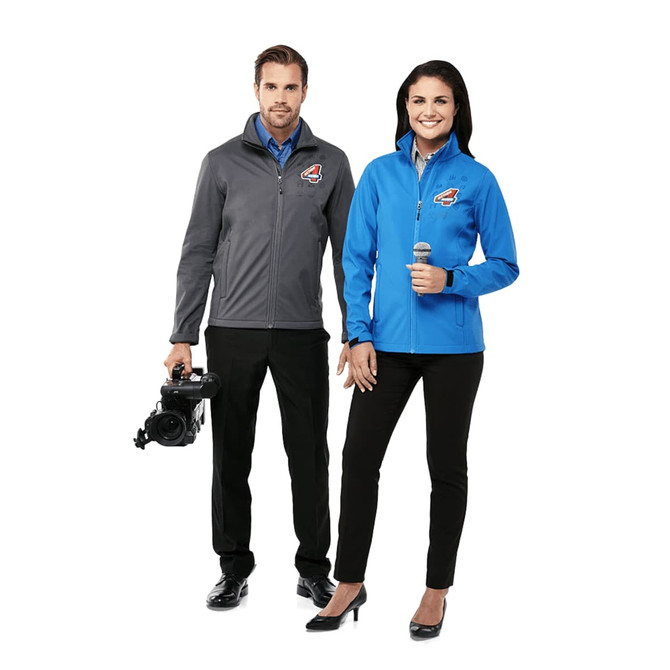 A grey and blue softshell jacket for women, featuring a logo, displayed on a model.