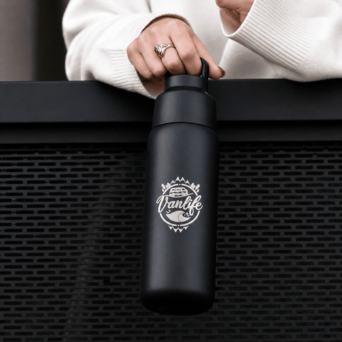 A drink bottle in matte black with a logo, featuring a twist lid and a durable design.