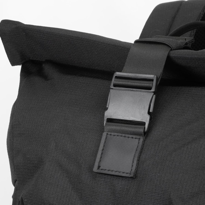 A black roll-up computer backpack featuring a secure buckle closure and textured fabric. It includes a logo.