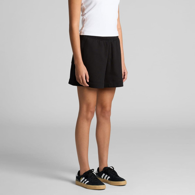 Black track shorts with an elastic waistband, worn by a person standing in a neutral pose, featuring a logo.