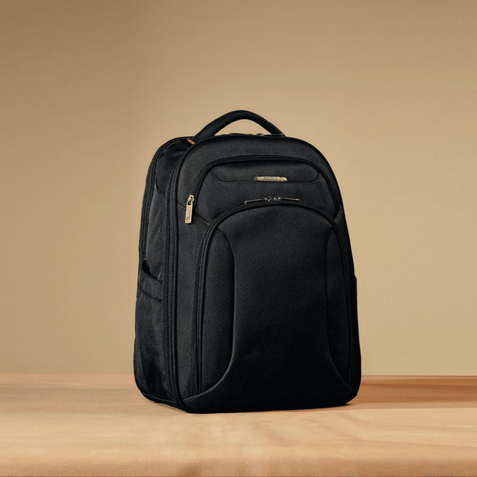 A black Samsonite Xenon 3.0 backpack with multiple compartments and a carrying handle. It features a logo.