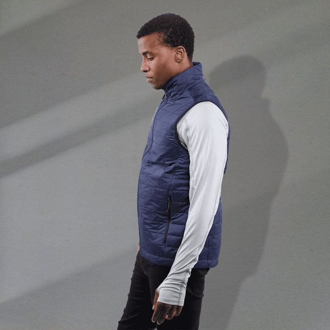 A men's lightweight packable insulated puffer vest in navy, featuring a zippered pocket and a logo.