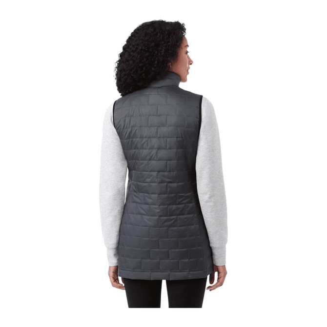 A woman wearing a dark grey lightweight packable insulated puffer vest, viewed from the back. The vest has a logo.