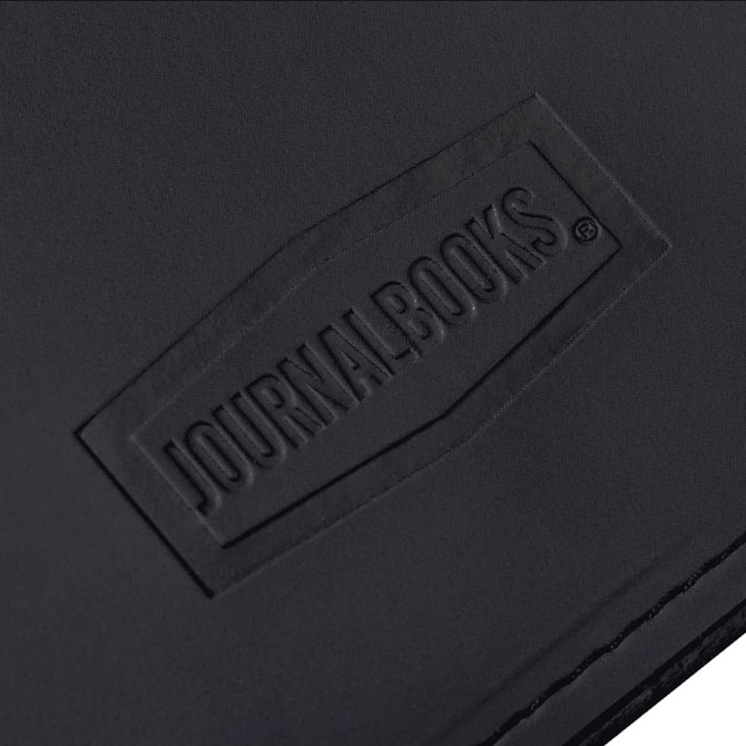 A black leather journal with a textured surface featuring a logo. The design is simple and elegant.