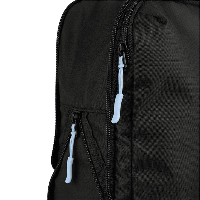 A black packing cube with blue zipper pulls, showcasing a close-up of the zippered compartment.