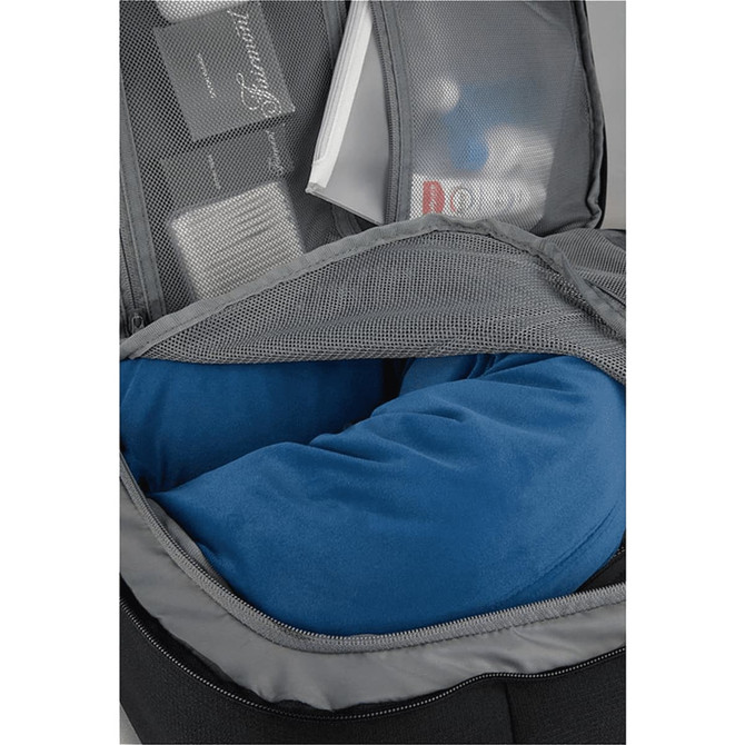 A travel backpack in grey with a blue neck pillow visible in an inner compartment, along with other items.
