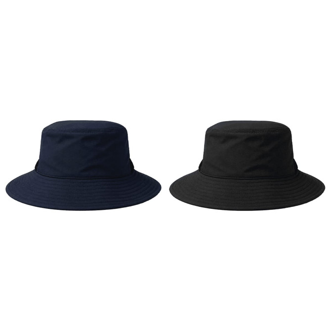 Two recycled surf hats are displayed, one in navy blue and the other in black, both with wide brims and a logo.