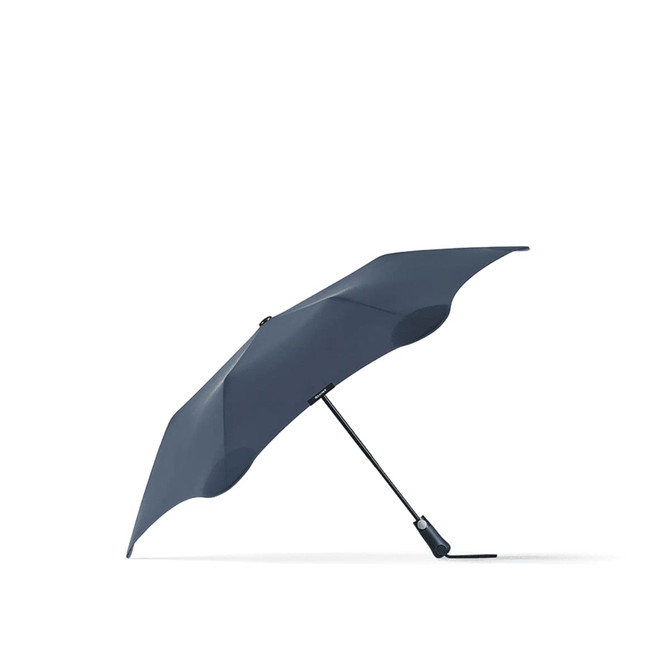 A navy umbrella with a unique design and a black handle, featuring a logo on its side.