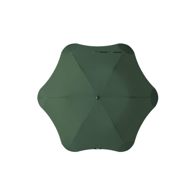 A green BLUNT Metro umbrella with a unique octagonal shape and a central button for opening and closing.