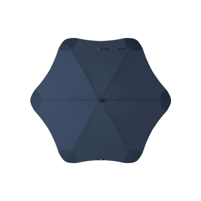 A navy blue BLUNT Classic Umbrella with a unique star shape and a central handle. It features a logo on the design.