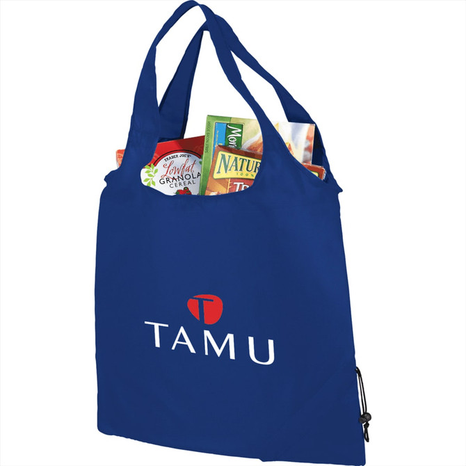 A blue foldaway shopper tote filled with various food items and featuring a logo.