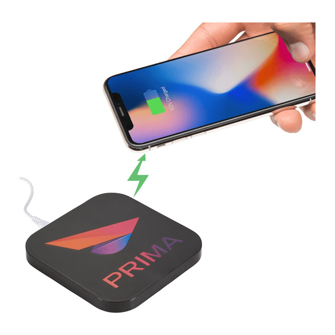 A black wireless charging pad with dual outputs, featuring a logo, and a phone being charged on top.