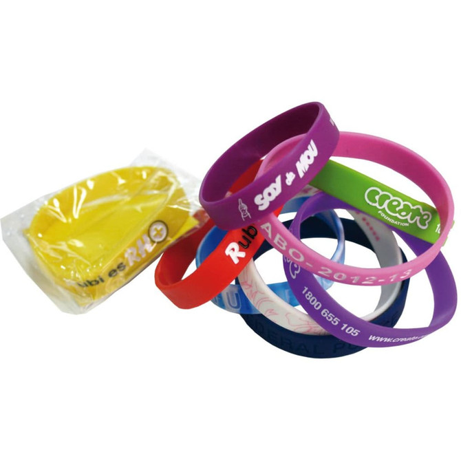 Silicon wristbands in various colours including yellow, purple, pink, and blue, with an attached logo.