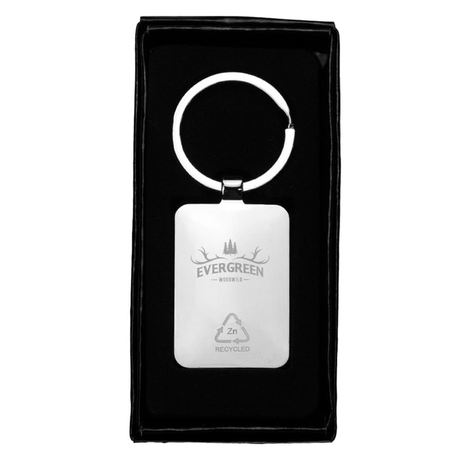 A rectangular zinc alloy keyring with a bamboo accent, presented in a black box. It features a logo.