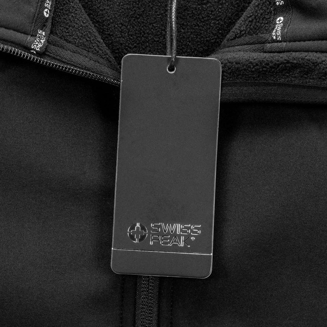 A black softshell jacket with a branded tag attached near the collar. The fabric appears soft and warm.