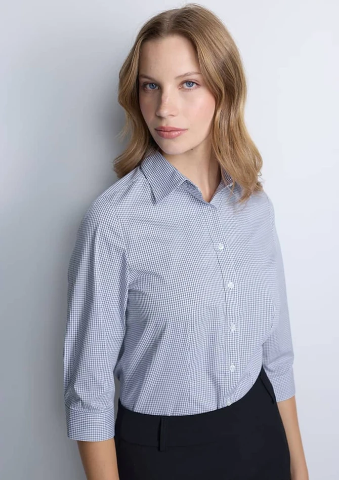 A women's 3/4 sleeve shirt in a blue and white check pattern, featuring a collar and button front.