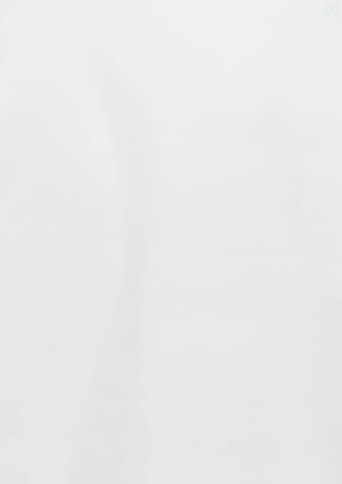 A white 3/4 sleeve shirt with a logo. The fabric appears smooth and lightweight.